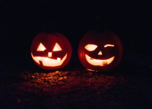 two lighted jack-o-lanterns during night time